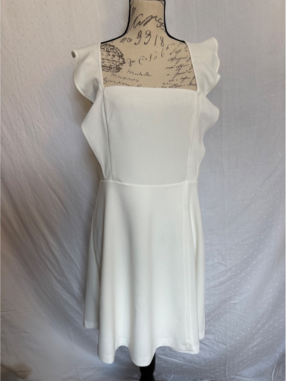 NWT. BCBG Paris Short Ruffle Strap Dress. Ivory color. Size Large.
